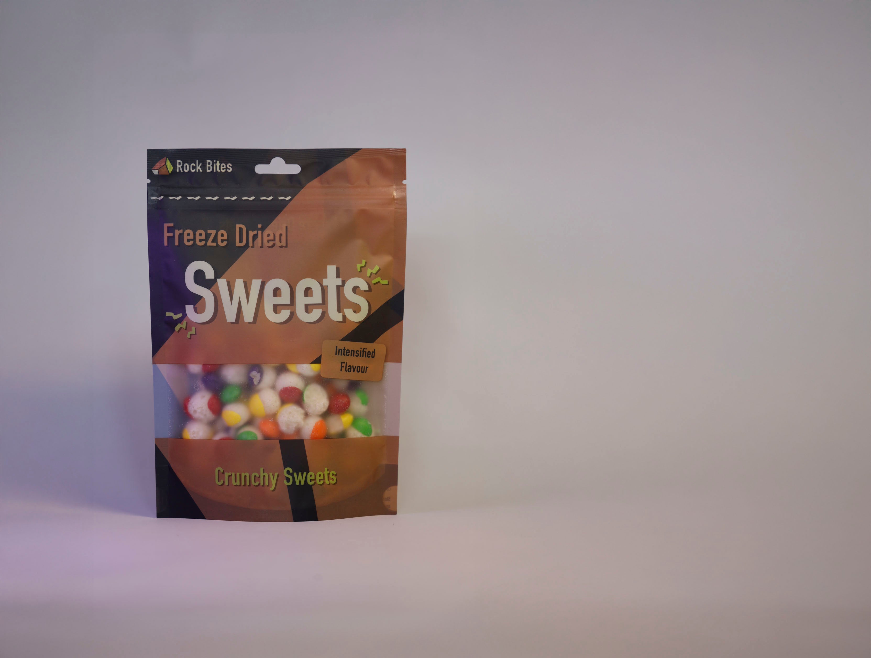 Packaging of freeze-dried sweets on a gray background