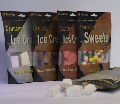 Four packages of Crunchy Ice Cream and Freeze Dried Sweets on a white background