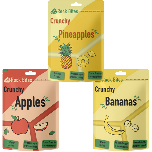 Three packages of Rock Bites snacks: Pineapples, Apples, and Bananas on a white background.