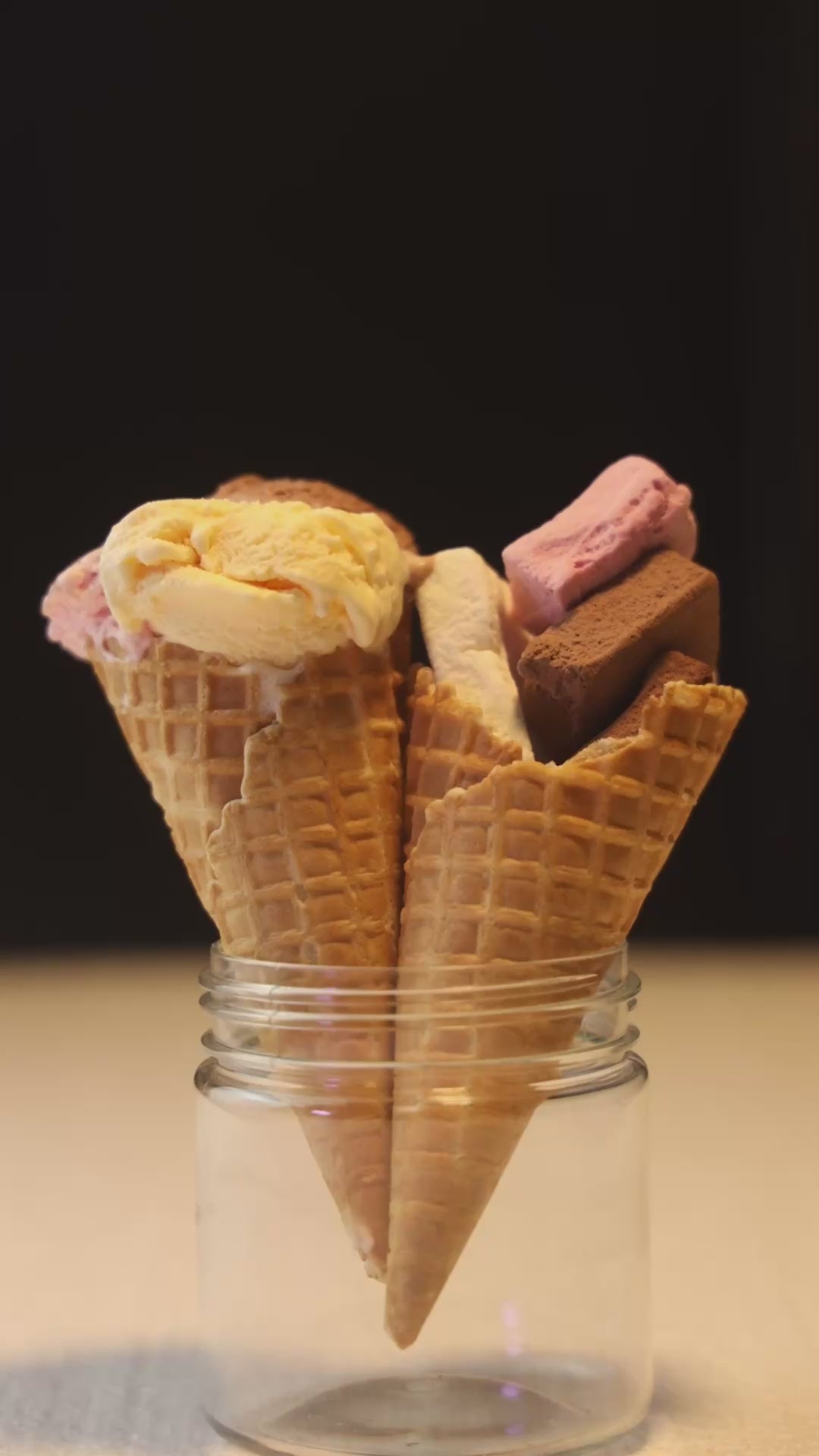 Load video: ice cream cone next to a cone that has freeze dried ice cream
