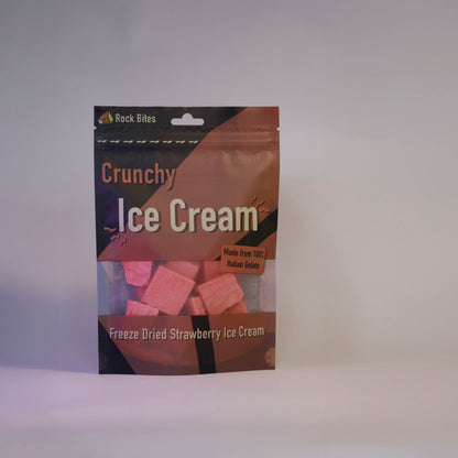 Packaging of Crunchy Ice Cream with pink treats on a gray background